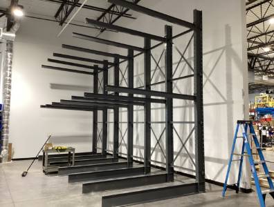 Installed cantilever rack system with open storage arms