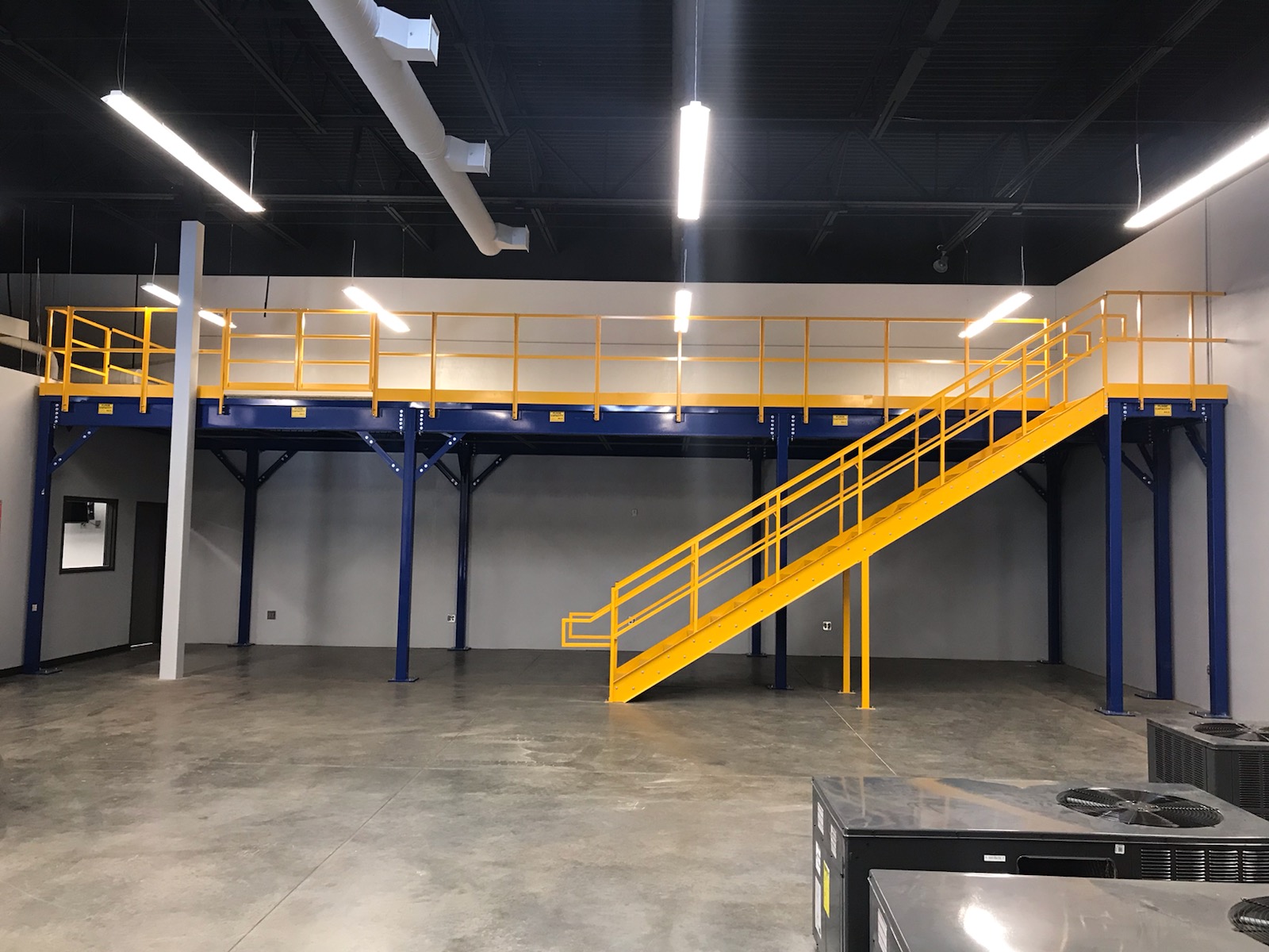 Free standing mezzanine supported by its own columns, independent of the building structure