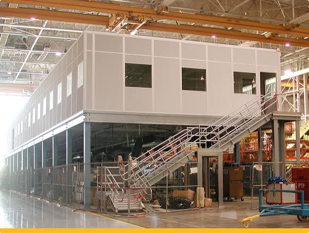 Modular office on top of a mezzanine underneath storage